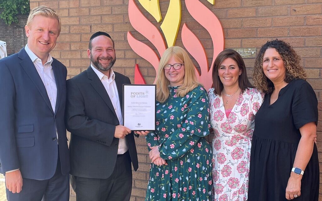 L-RL Oliver Dowden MP, Rabbi and Rebbetzen Feldman, and volunteers Deborah Dobrin and Melanie Barnett