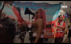Cllr Sam Gorst (right) alongside Corbyn at the demo