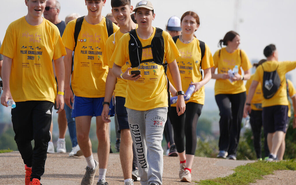 More than a hundred brightly dressed walkers put their best feet forward and raised £50,000 in memory of five-year-old Shani Berman, from Elstree, who died from a rare heart condition
