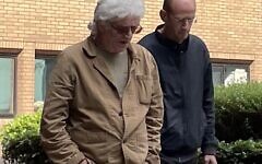 Piers Portman, right, leaves court with conspiracy theorist Matthew Delooze, left.  (Campaign Against Antisemitism)