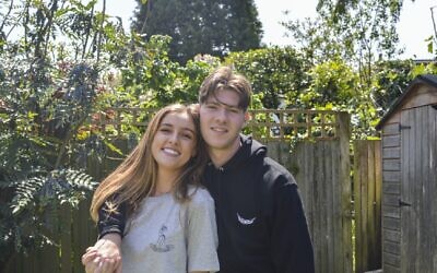 Joe with girlfriend Jess wearing his  merchandise. They met via the podcast