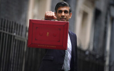 Chancellor of the Exchequer Rishi Sunak holds his ministerial 'Red Box' outside 11 Downing Street, London, before delivering his Budget to the House of Commons. Picture date: Wednesday October 27, 2021.