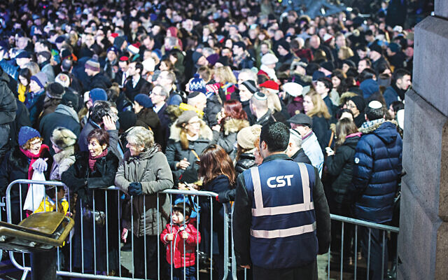 CST security official at Chanukah in the Square. (© Blake Ezra Photography)