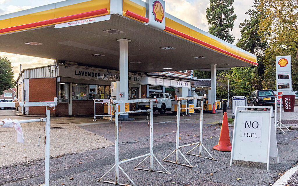 The forecourt of a petrol station during a run on the pumps