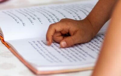 A child reading in Hebrew (Image: Unsplash)