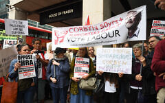 Activists outside a meeting of the Labour National Executive Committee in London which is expected to decide on whether to adopt the International Holocaust Remembrance Alliance (IHRA) definition of anti-Semitism and its examples, which has been the subject of a bitter row within the party over recent months.. Photo credit: Stefan Rousseau/PA Wire