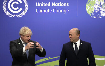 Prime Minister Boris Johnson (right) greets Israel's Prime Minister Naftali Bennett at the Cop26 summit at the Scottish Event Campus (SEC) in Glasgow.