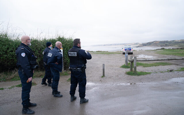 French police look out over a beach near Wimereux in France believed to be used by migrants trying to get to the UK after a boat capsized off the French coast with the loss of 31 lives on Wednesday. An emergency search was sparked when a fishing boat sounded the alarm after spotting several people in the sea off the coast of France. Authorities found 31 bodies and two survivors while one person was missing. Picture date: Thursday November 25, 2021.