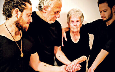 From left: Amir, Oded and Livia Ravek and Daniel Philosoph with the Auschwitz concentration camp number 4559 on their arms
