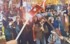 Nationalist rally-goers burn a book in Kalisz, Poland, Nov. 11, 2021. (Karolina Pawliczak/Twitter) Nationalist rally-goers burn a book in Kalisz, Poland, Nov. 11, 2021. (Karolina Pawliczak/Twitter)