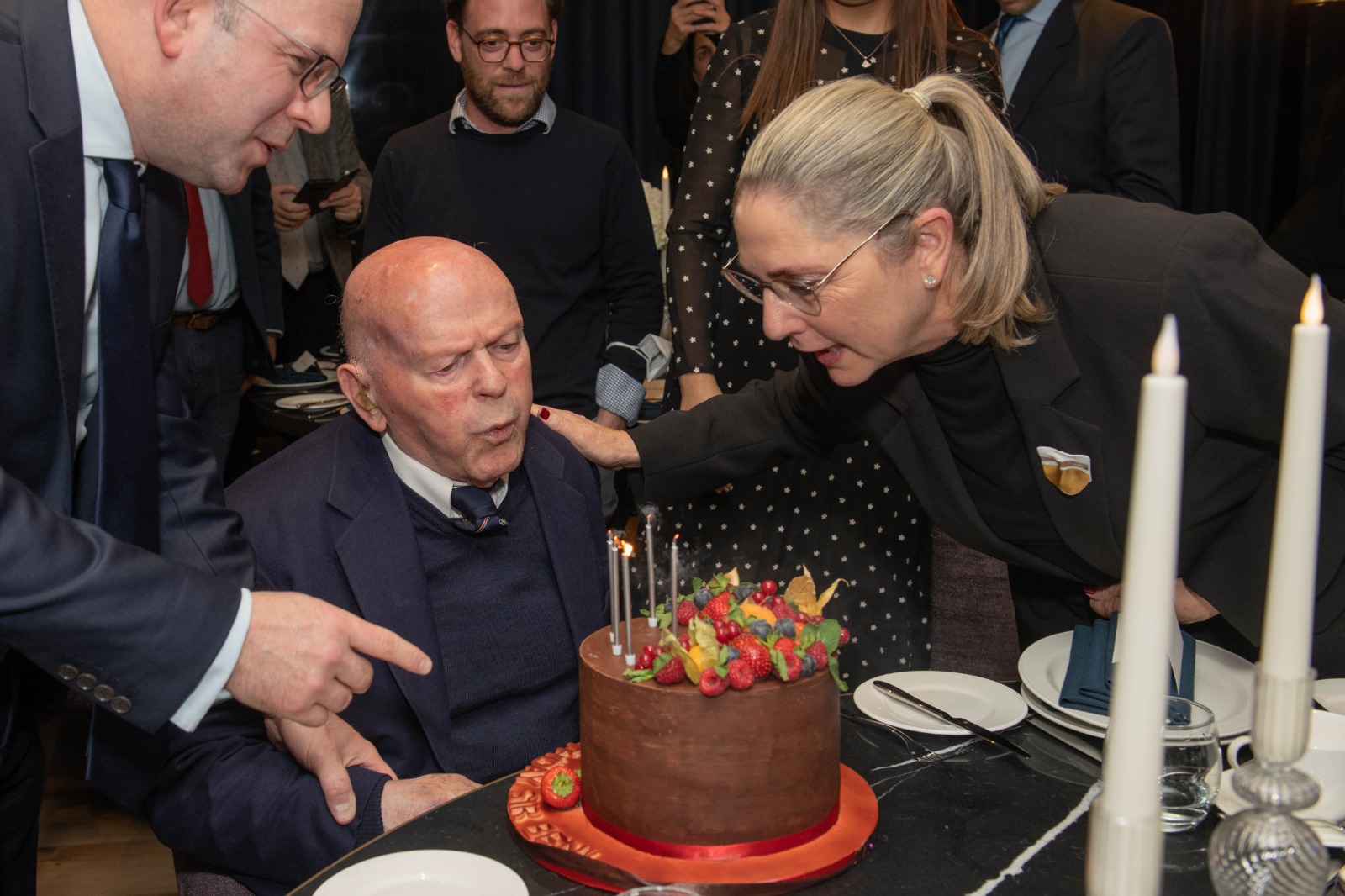 Sir Ben blows out some birthday candles