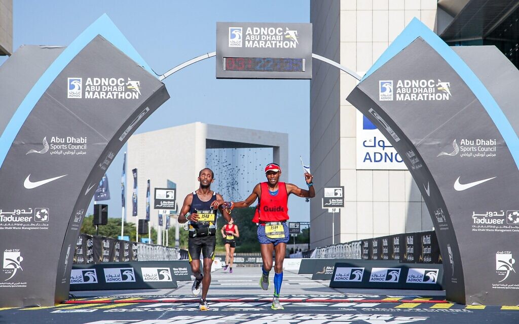 Avi Solomon crosses the finish line in Abu Dhabi