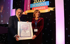 Lady Lira Winston with Rabbi Lord Sacks picking up her Lifetime Achievement Award (Marc Morris Photography)