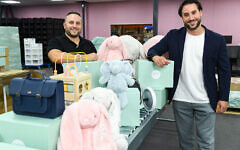 Co-founders of My 1st Years, Daniel Price and Jonny Sitton at the reopening of the brand’s Northampton factory following the May 2021 arson attack at the site which caused the company to pause operations for over 18 weeks. Picture date: Wednesday September 22, 2021. PA Photo. The fire destroyed over £3m in stock and more than £1m in equipment, as well as a 100,000 square foot warehouse, head office and photography studio, and forced extensive refunds to customers. Despite the incident, the personalised children gifting brand were able to ensure that all of their 120-strong workforce retained their jobs and are relaunching with a new range of products for consumers to shop and personalise. Photo credit should read: Doug Peters / PA Wire
