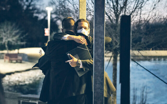 Rabbi Charlie Cytron- Walker is embraced by a congregant after the synagogue siege
