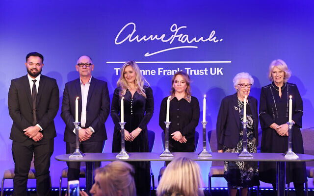 Azeem Rafiq, guest, Katie Amess, guest, Eva Schloss MBE, step-sister of Anne Frank and Honorary President of the Anne Frank Trust UK, and the Duchess of Cornwall take part in a candle lighting ceremony during a reception for the Anne Frank Trust at the InterContinental London, Park Lane, London. Picture date: Thursday January 20, 2022.