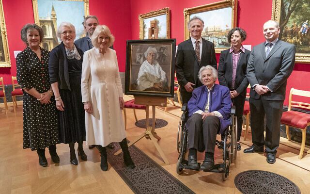 The Duchess of Cornwall with artist Peter Kuhfeld and Holocaust survivor Anita Laskar-Wallfischof (front right) and her family at an exhibition at The Queen's Gallery, Buckingham Palace, London, of 'Seven Portraits: Surviving the Holocaust', which were commissioned by the Prince of Wales to pay tribute to Holocaust survivors. Picture date: Monday January 24, 2022.
