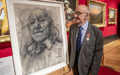 Holocaust survivor Zigi Shipper stands besides his portrait in an exhibition at The Queen's Gallery, Buckingham Palace, London, of 'Seven Portraits: Surviving the Holocaust'. Picture date: Monday January 24, 2022.