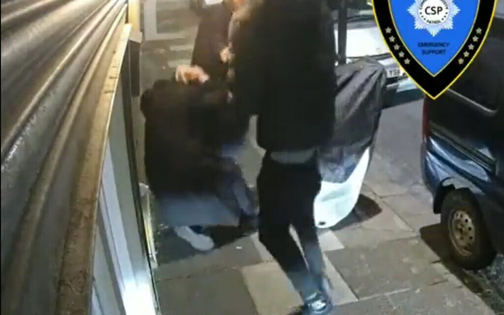 Screengrab dated 26/01/22 taken with permission from video posted on twitter by @Shomrim of a teenager attacking two Jewish men while they were locking up their shop in Cadoxton Avenue, Haringey, London. Issue date: Thursday January 27, 2022.