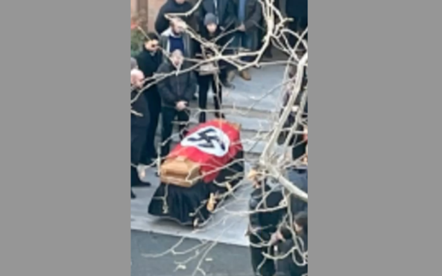 A view of the casket draped in a Nazi flag in Rome, Jan. 11, 2022. (Screenshot from Open)