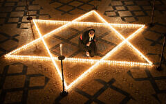 The Reverend Canon Michael Smith, Acting Dean of York, helps light six hundred candles in the shape of the Star of David, in memory of more than 6 million Jewish people murdered by the Nazis in the Second World War, in the Chapter House at York Minster in York, part of York Minster's commemoration for International Holocaust Day. The Reverend Canon Michael Smith, Acting Dean of York, helps light six hundred candles in the shape of the Star of David, in memory of more than 6 million Jewish people murdered by the Nazis in the Second World War, in the Chapter House at York Minster in York, part of York Minster's commemoration for International Holocaust Day.