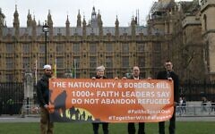 Rabbi David Mason alongside faith leaders, protesting the bill