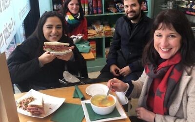 Reeves drinking chicken soup during some campaigning. She is joined by Liron Vellement,  candidate for Whetstone ward and Child's Hill Anne Clarke in red.