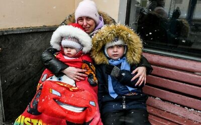 2HWT2WH A woman wih two children waits for an evacuation train, Zaporizhzhia, southeastern Ukraine on March 7, 2022. Photo by Dmytro Smoliyenko/Ukrinform/ABACAPRESS.COM Credit: Abaca Press/Alamy Live News