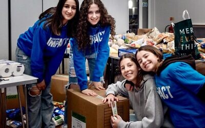 Project ImpACT volunteers at Hampstead Garden Suburb Synagogue pack goods to be sent to Ukrainian refugees in Poland, 13 March, 2022 (Emma Ziff Photography)