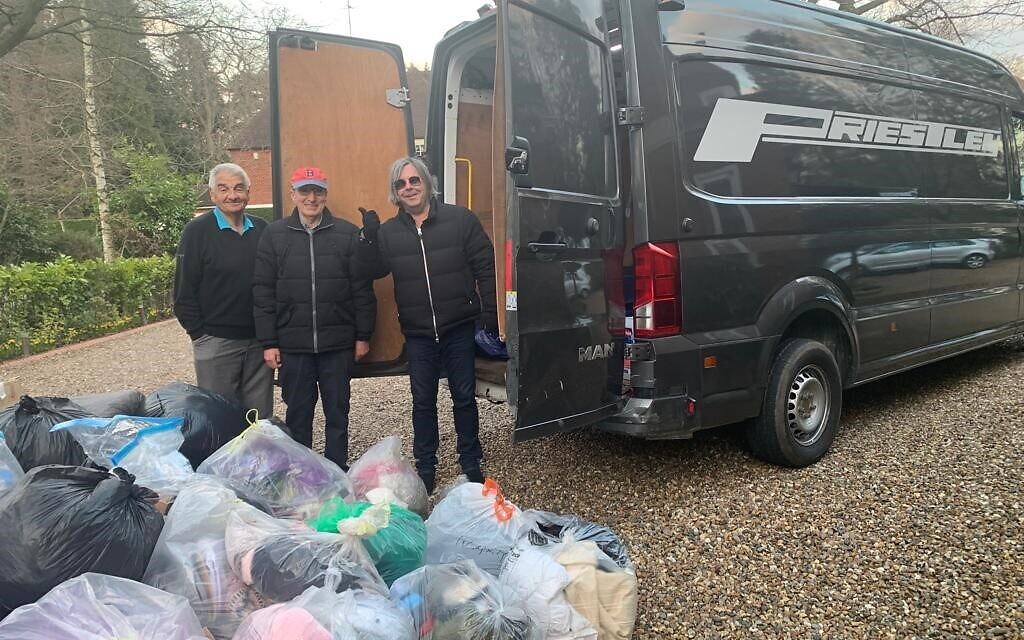 Volunteers from Northwood Synagogue pack a van with clothes to be sent to Ukrainian refugees.