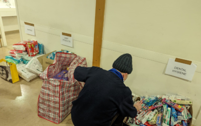 A volunteer at Barnet Synagogue prepares packages of aid for Ukrainian refugees, March 2022.