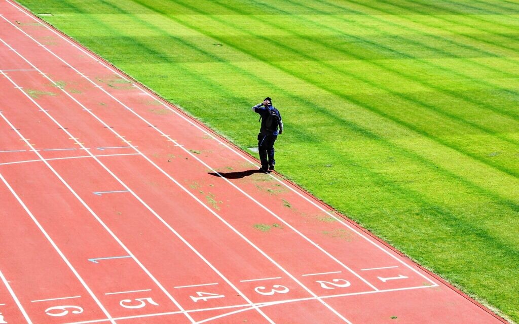 Man on a running track (Max Williams/Unsplash)