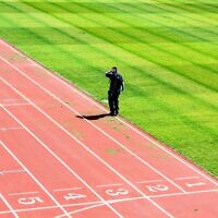 Man on a running track (Max Williams/Unsplash)