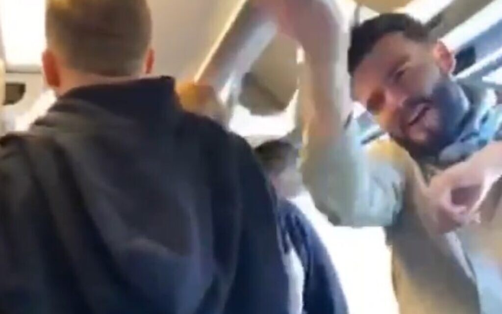 Football fans sing an antisemitic song while on a train, apparently on 19 March, 2022. (Screengrab/Twitter)
