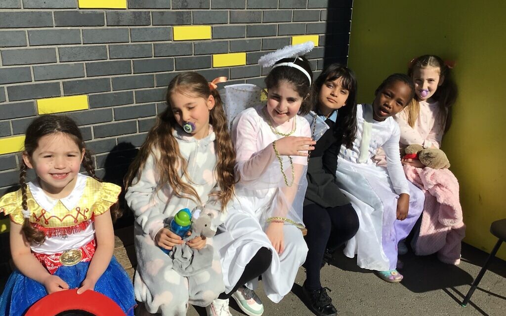 Kids from Wohl Ilford Jewish Primary School heard the Megillah, read by Rabbi Mordechai Wollenberg of Woodford Forest United Synagogue and took part in a fancy dress parade. Kids from Wohl Ilford Jewish Primary School heard the Megillah, read by Rabbi Mordechai Wollenberg of Woodford Forest United Synagogue and took part in a fancy dress parade.