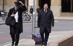 Alan Moher, 57, (right) arrives at Southwark Crown Court on 1 April, 2022, where was sentenced after pleading guilty to engaging in coercive or controlling behaviour after failing to grant his wife a Jewish religious divorce. (PA) Alan Moher, 57, (right) arrives at Southwark Crown Court on 1 April, 2022, where was sentenced after pleading guilty to engaging in coercive or controlling behaviour after failing to grant his wife a Jewish religious divorce. (PA)