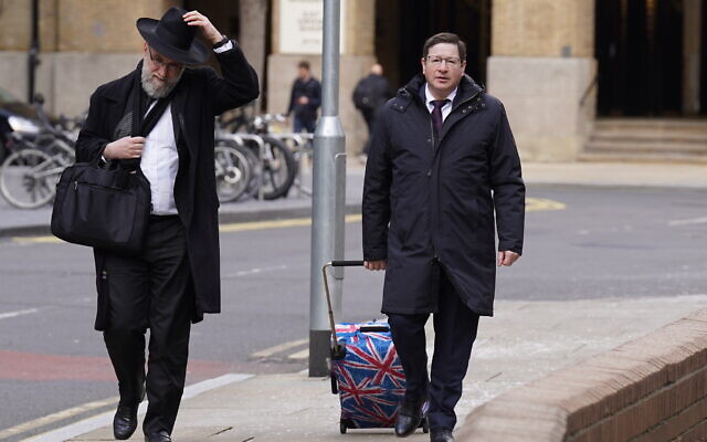 Alan Moher, 57, (right) arrives at Southwark Crown Court on 1 April, 2022, where was sentenced after pleading guilty to engaging in coercive or controlling behaviour after failing to grant his wife a Jewish religious divorce. (PA)