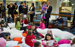 Israeli MK Nachman Shai hugs his granddaughter prior to "Story Hour" in which he read a story by Lea Goldberg to granddaughter's kindergarten class Israeli MK Nachman Shai hugs his granddaughter prior to "Story Hour" in which he read a story by Lea Goldberg to granddaughter's kindergarten class