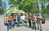 Eli Beer and his entourage together with Olga meet the mayor of Bucha, Anatoliy Fedoruk and Ukrainian soldiers near Bucha)