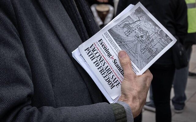 Piers Corbyn attends an anti-lockdown musical event in Brixton handing out his controversial Covid-19 'Auschwitz leaflet'. London, UK.