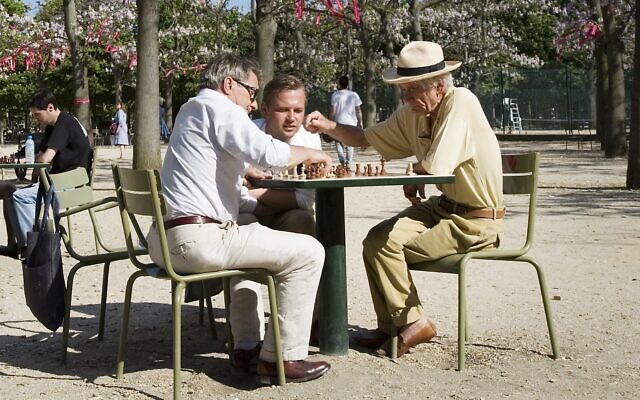 Old retired men playing chess at the Jardins du Luxembourg, Paris