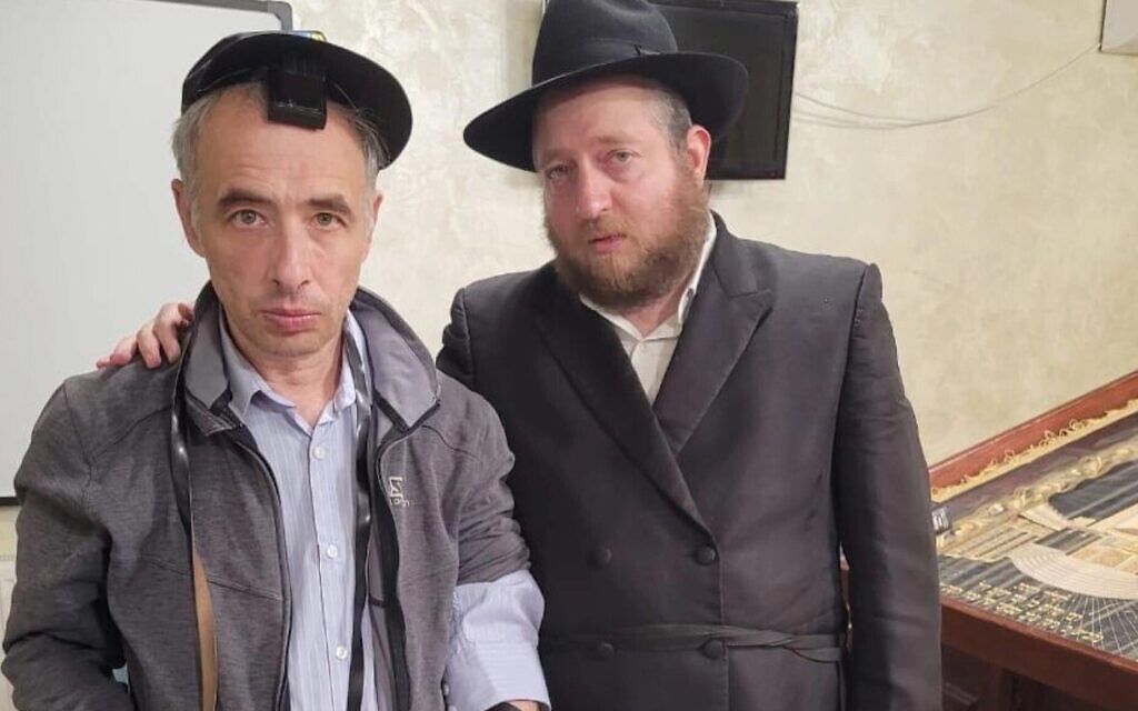 Rabbi Shaul Horowitz, right, meets a Jewish refugee attending service at the synagogue of Vinnytsia, Ukraine in June 2022. (Courtesy of Shaul Horowitz/via JTA)