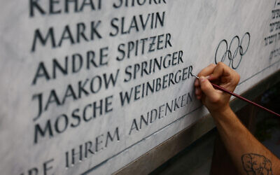 A stone cutter renovates a memorial stone for the 11 Israeli athletes killed by the Palestinian Black September group during the 1972 Olympic Games in Munich earlier this month (Photo: Reuters/Wolfgang Rattay)