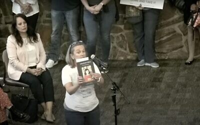 Gretchen Veling reads aloud from "Anne Frank's Diary: The Graphic Adaptation" at a board meeting for the Keller Independent School District in Keller, Texas this week (Photo: Screenshot)