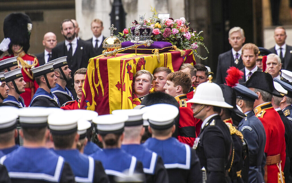 The coffin of Queen Elizabeth II is placed on a gun carriage during her funeral service in Westminster Abbey in central London Monday Sept. 19, 2022.