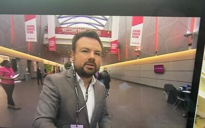 Lloyd Duddridge is captured on BBC News leafleting delegates at this year's Labour conference in Liverpool