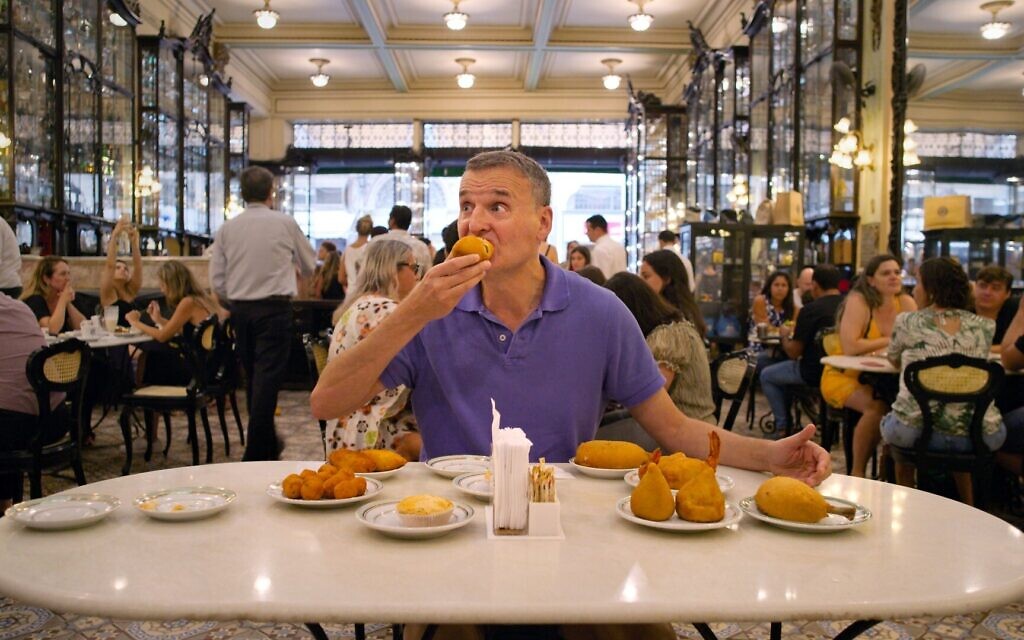 Phil Rosenthal being fed