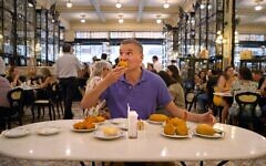 Phil Rosenthal being fed Phil Rosenthal being fed
