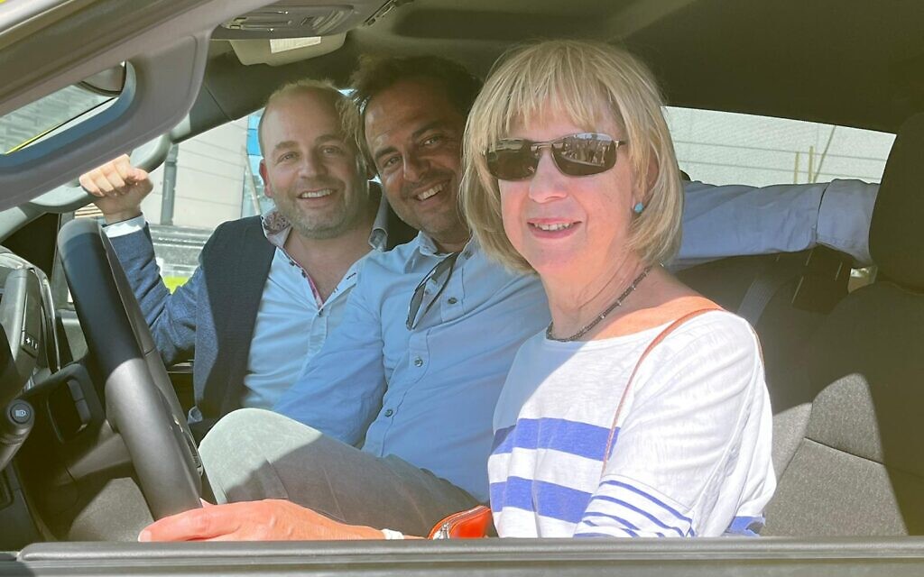 Lady Sacks at the wheel of the new bloodmobile with MDA UK chief
executive Daniel Burger (left) and Jewish News editor Richard Ferrer
