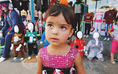 Syrian refugee, Samah Aloshi, 3, stands in Zaatari refugee camp near the Jordan-Syria border. Syrian refugee, Samah Aloshi, 3, stands in Zaatari refugee camp near the Jordan-Syria border.